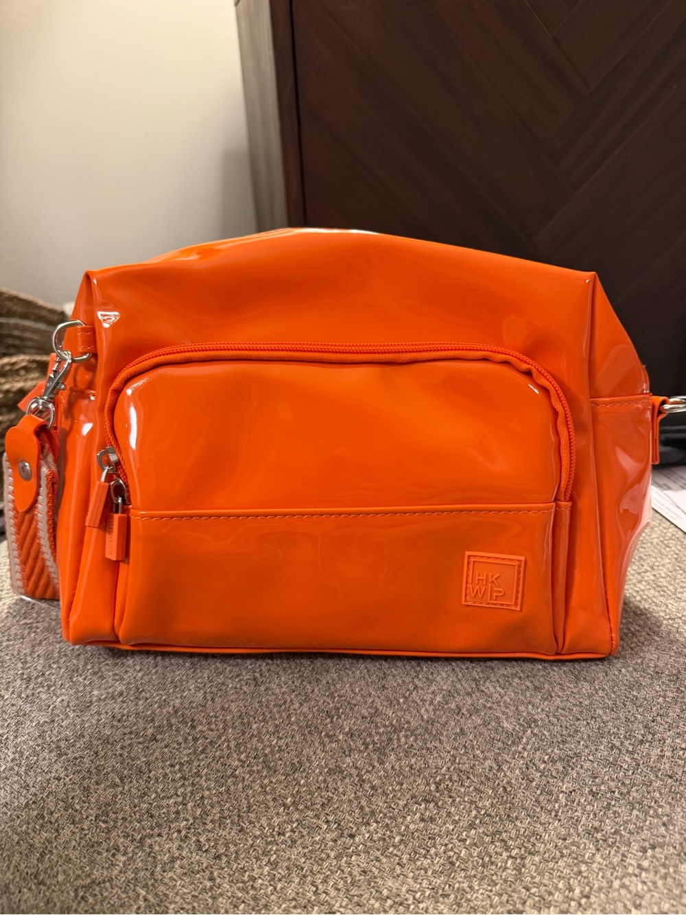 HKWP Orange Gloss Crossbody Bag with Front Zip Pocket